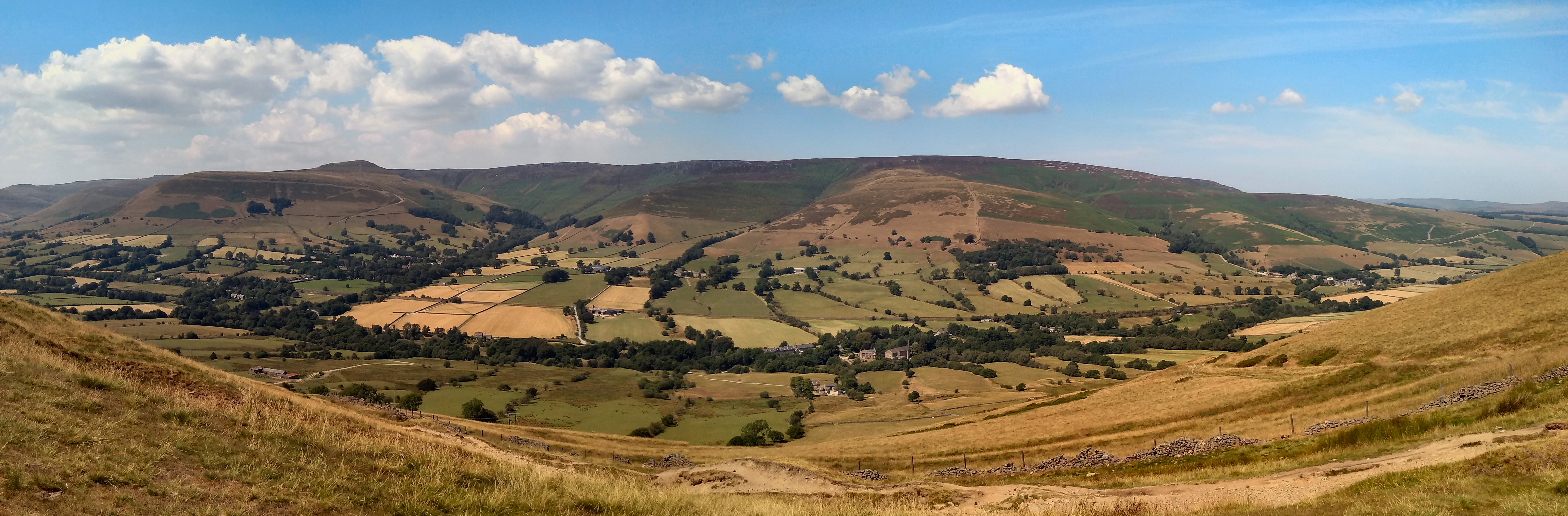 The green hills and open valley seen from Mam Tor